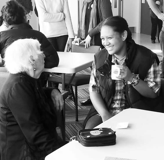 Young person and older person connecting over a cuppa